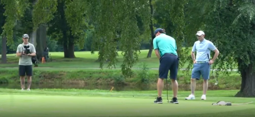 Filming a putt on the green